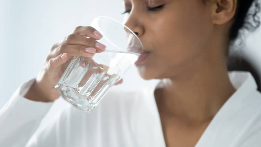 Woman drinking Escondido tap water